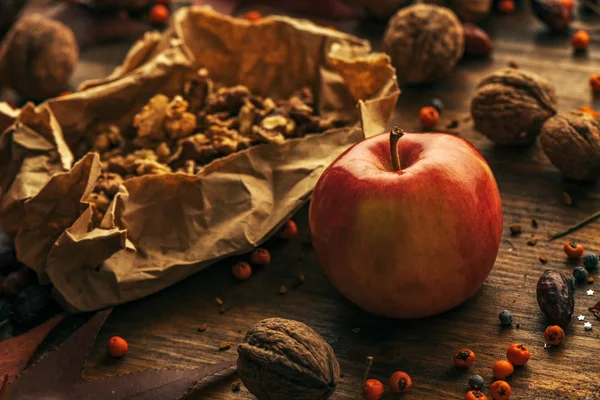 Tasty red apple and walnut fruit — Stock Photo, Image