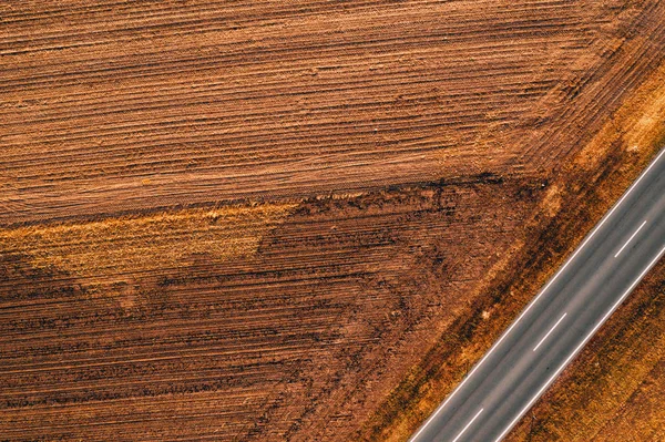 Aerial view of empty road through countryside — Stock Photo, Image