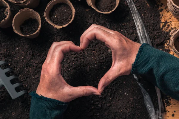Gardener hand heart gesture