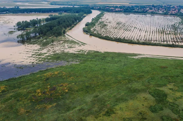 Flooded plain countryside landscape and river from drone pov. Tamis river in Vojvodina province, Serbia.