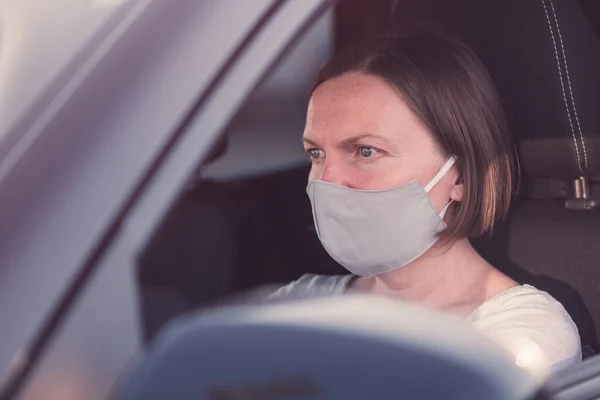 Serious Female Driver Protective Face Mask Holding Steering Wheel Car — Stock Photo, Image