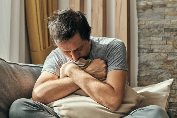 Depressed Man Sitting Living Room Sofa Hugging Pillow Portrait Adult — Stock Photo, Image