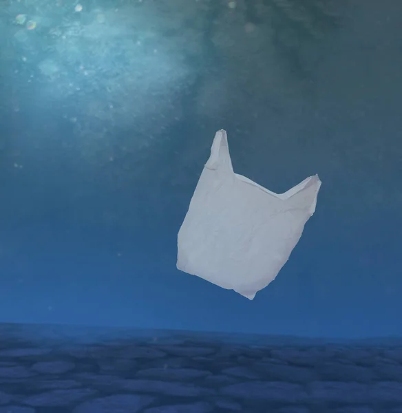 Plastic ocean pollution, white bag underwater.