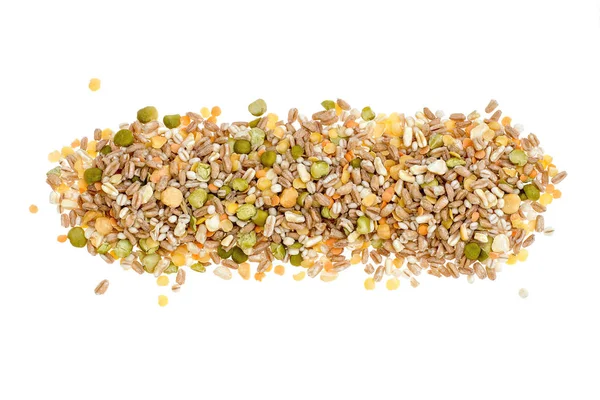 Assorted grains and pulses heap on white, top view. Winter food includes split peas, red and yellow lentils, pearl barley, kamut, spelt. — Stock Photo, Image