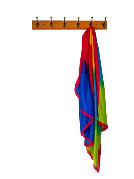 Rainbow silky scarf hanging on coat rack, isolated on white. — Stock Photo, Image