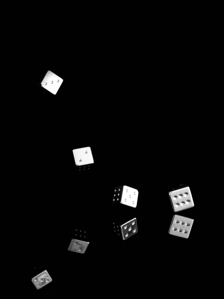 Tumbling shiny dice, on black background. Business concept, success etc. — Stock Photo, Image