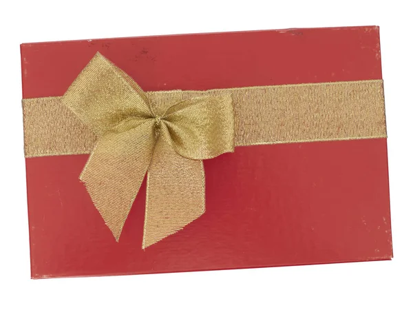 Old red Christmas or Valentine gift box with gold ribbon bow, isolated on white background. Last years romance. Top view. — Stock Photo, Image