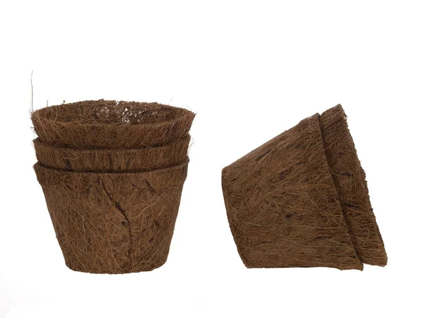 Coir plant pots isolated on white. Environmentally friendly spring gardening. Peat substitute. — Stock Photo, Image