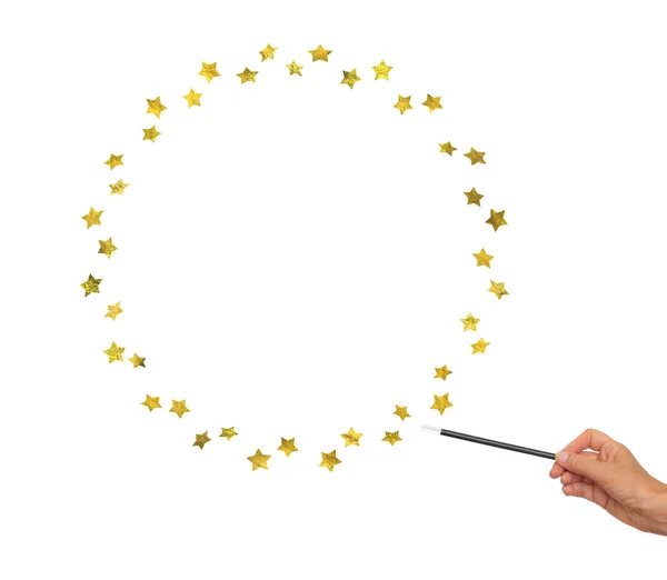 Magic wand in hand with gold stars for frame, border. White background. — Stock Photo, Image