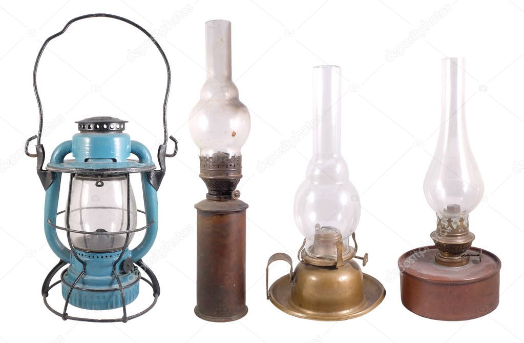 Four antique lamps of various kinds and colors isolated on white