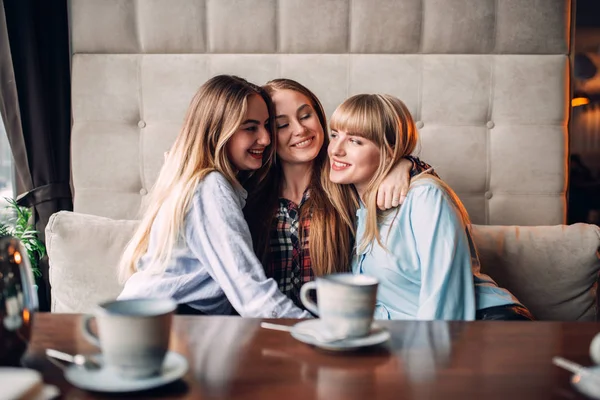 Three Happy Female Friends Drinking Coffee Cafe Hugging — Stock Photo, Image