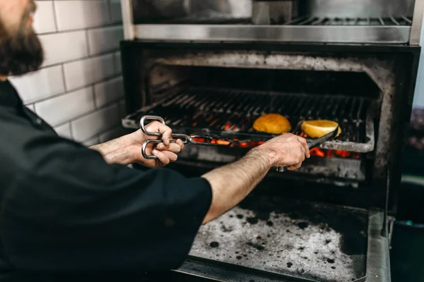 Male Cook Prepares Tasty Burger Grill Oven Hamburger Preparation Process — Stock Photo, Image