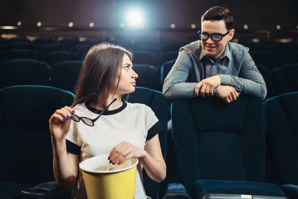 Young man and woman meet in the cinema before the movie. Showtime, entertainment industry