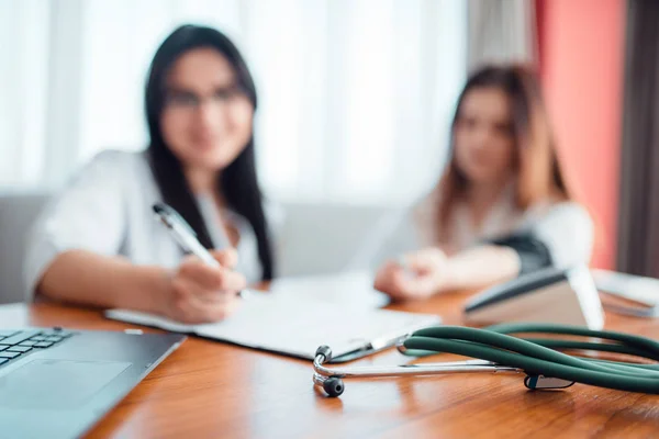 Doctor Examining Female Patient Professional Healthcare Stethoscope Foreground — Stock Photo, Image