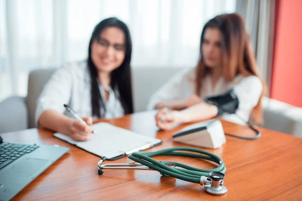 Doctor Examining Female Patient Professional Healthcare Stethoscope Foreground — Stock Photo, Image