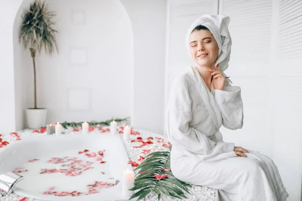 Attractive Woman White Bathrobe Towel Head Sitting Edge Bath Decorated — Stock Photo, Image