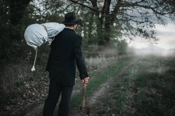 Slayer Axe Carries Victim Body Wrapped Canvas Forest Serial Maniac — Stock Photo, Image