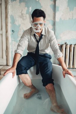 Funny businessman in swimming mask sitting on the edge of the bathtub. Business fortune concept clipart