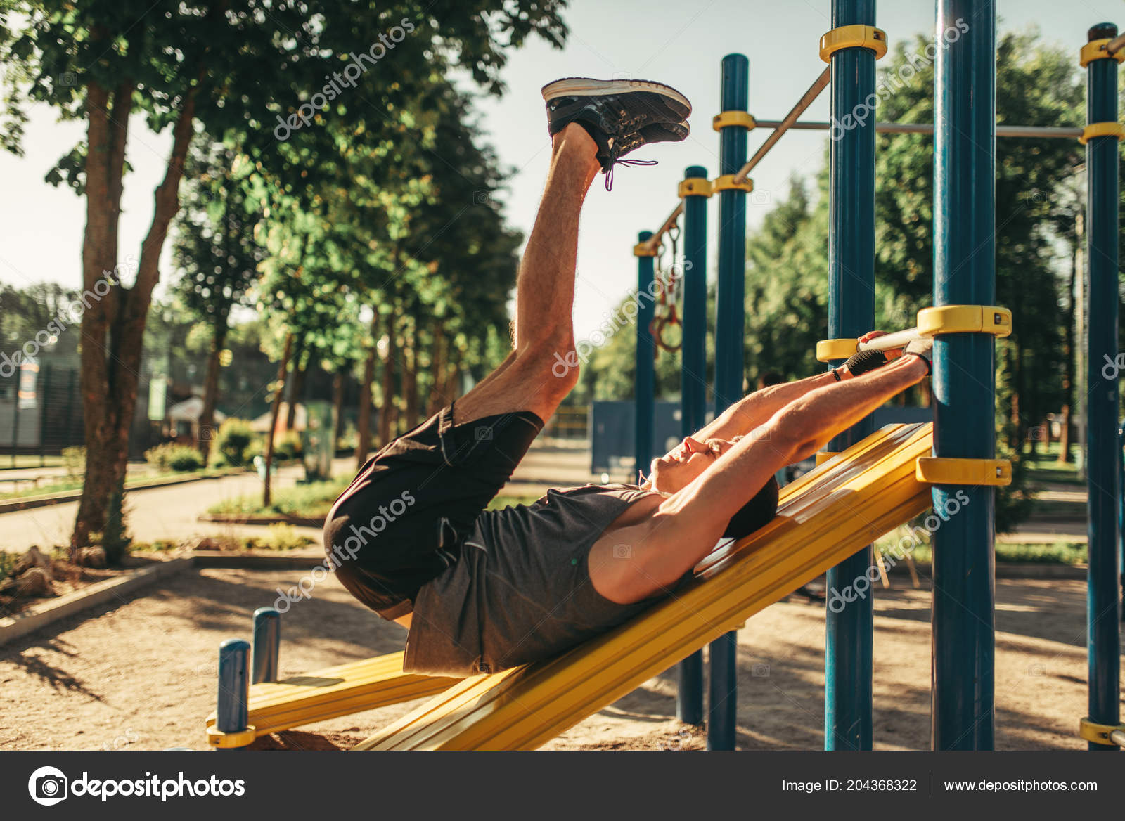 Man Sportswear Doing Abs Exercise Using Horizontal Bar Outdoor Fitness Stock Photo Nomadsoul1 204368322