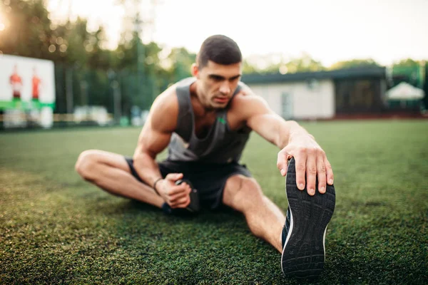 Male Athlete Outdoor Fitness Workout Sportsman Sits Grass Doing Stretching — Stock Photo, Image