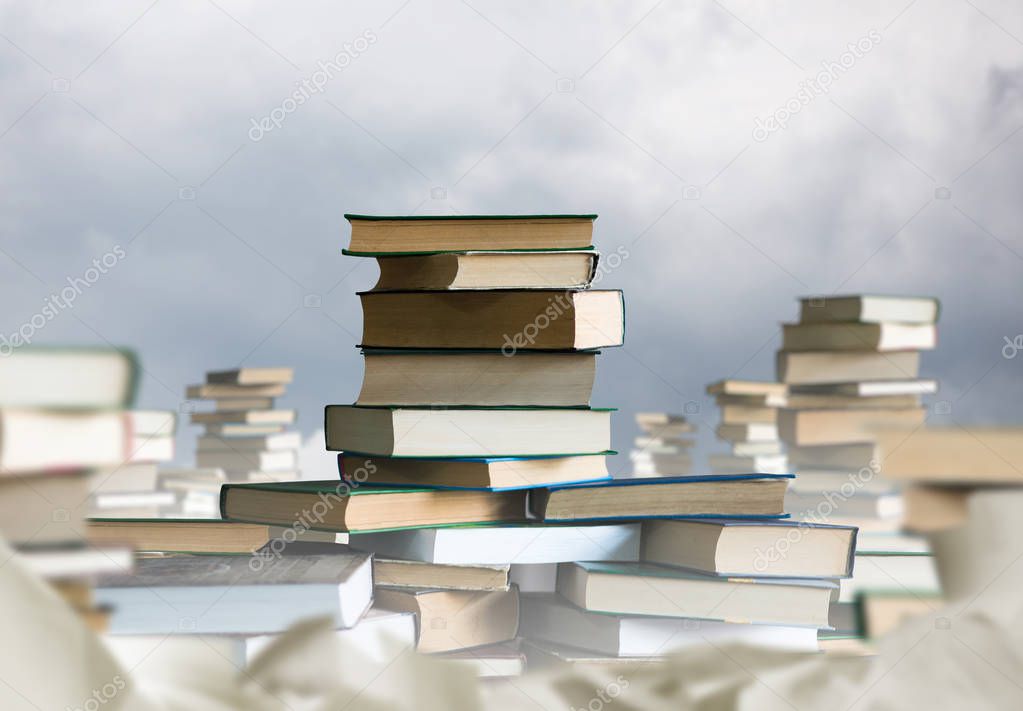 Stack of books. Lots of books around. Gaining knowledge and education concept