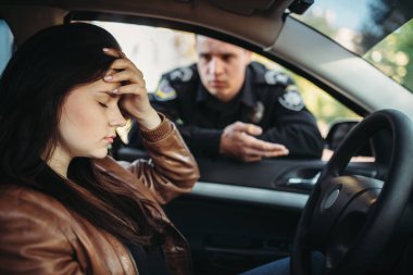 Male cop in uniform check female driver on the road. Law protection, car traffic inspector, safety control job clipart