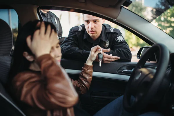 Male cop in uniform check female driver on the road. Law protection, car traffic inspector, safety control job