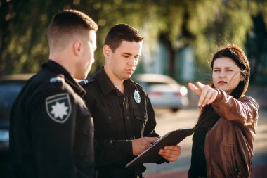 Policeman in uniform write testimony of female driver. Law protection, car traffic inspector, safety control job clipart