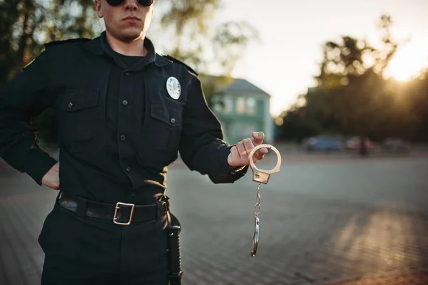 Serious Police Officer Uniform Sunglasses Holds Handcuffs Front View Cop — Stock Photo, Image