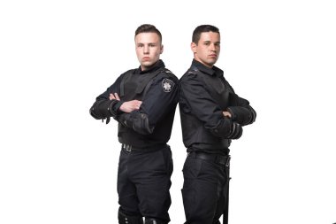 Özel kuvvet bir silah ve bir sopa siyah üniforma ve vücut zırh ile beyaz zemin üzerine asker. İki polis memuru özel mühimmat