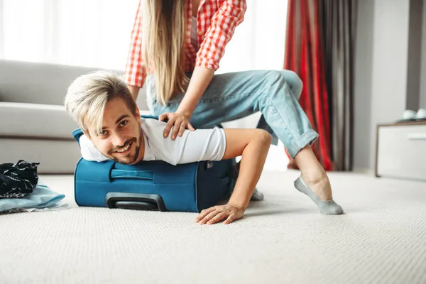 Cheerful Girl Packed Her Husband Suitcase Fees Vacation Concept — Stock Photo, Image