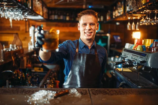 Male Bartender Apron Holds Out Fresh Alcoholic Beverage Bar Counter — Stock Photo, Image