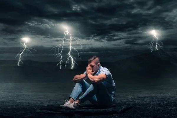 Young Man Sitting Ground Desert Storm Lightning Flash Background — Stock Photo, Image