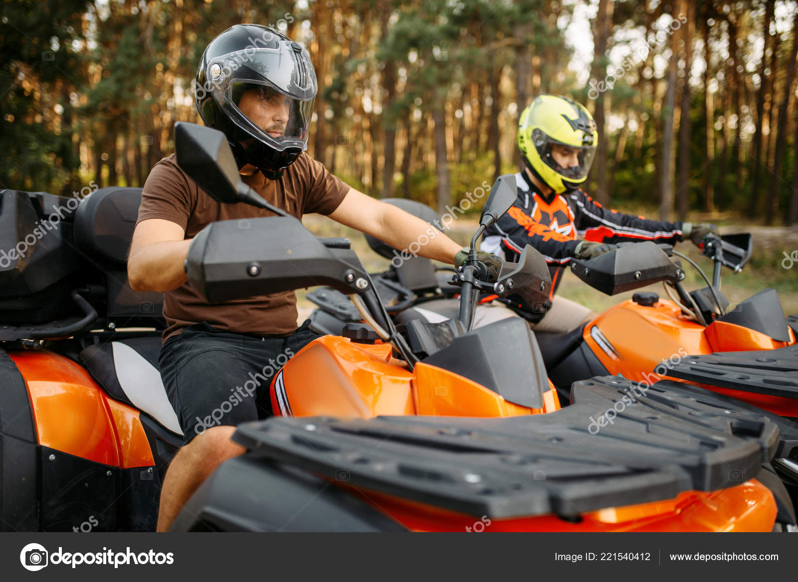 Two Quad Bike Riders Helmets Equipment Side View Closeup Summer