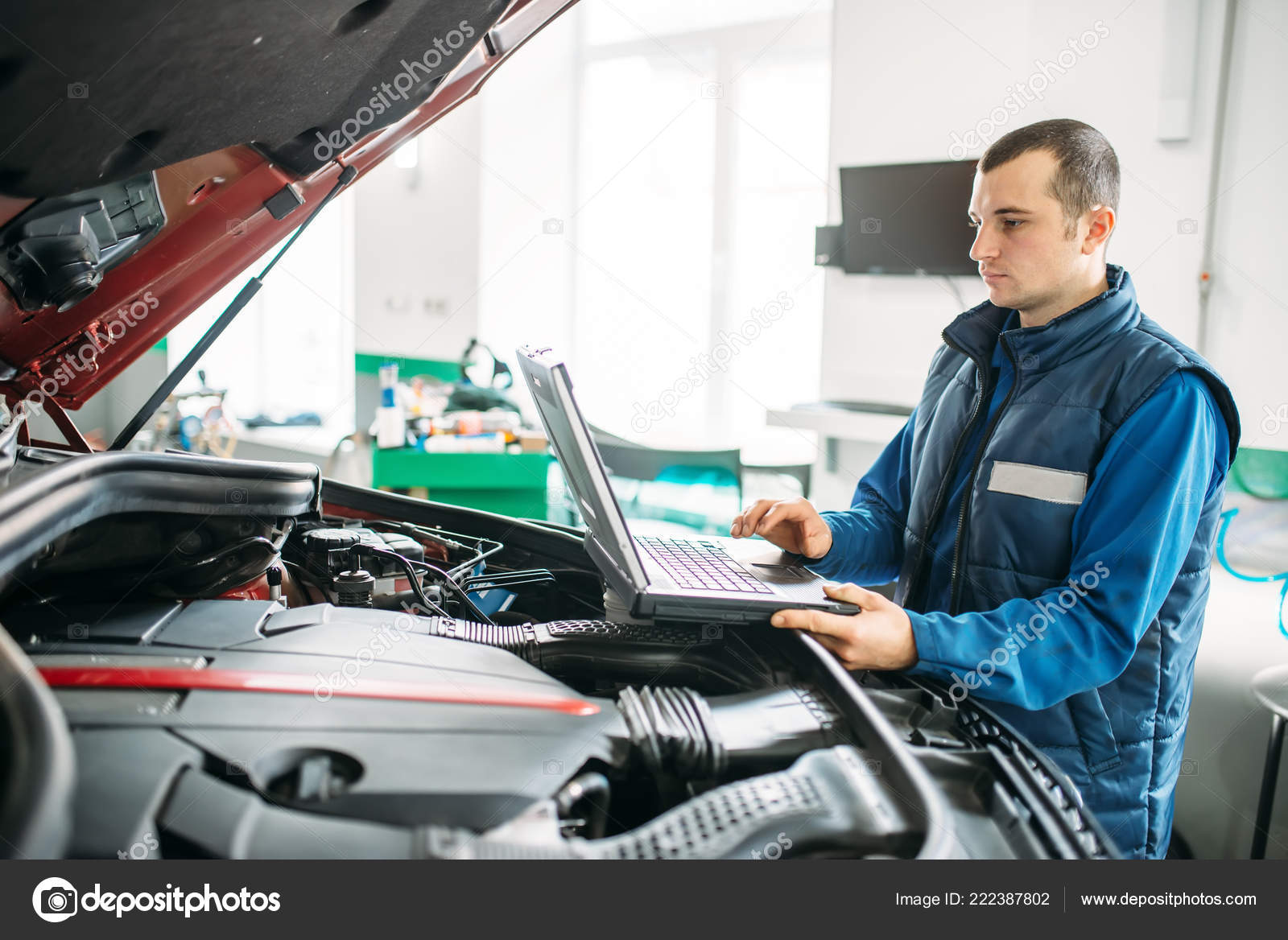 engineer makes computer diagnostics car autoservice vehicle auto engineer