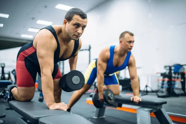 Two Male Weightlifters Doing Exercise Bench Dumbbell Gym Interior Background — Stock Photo, Image