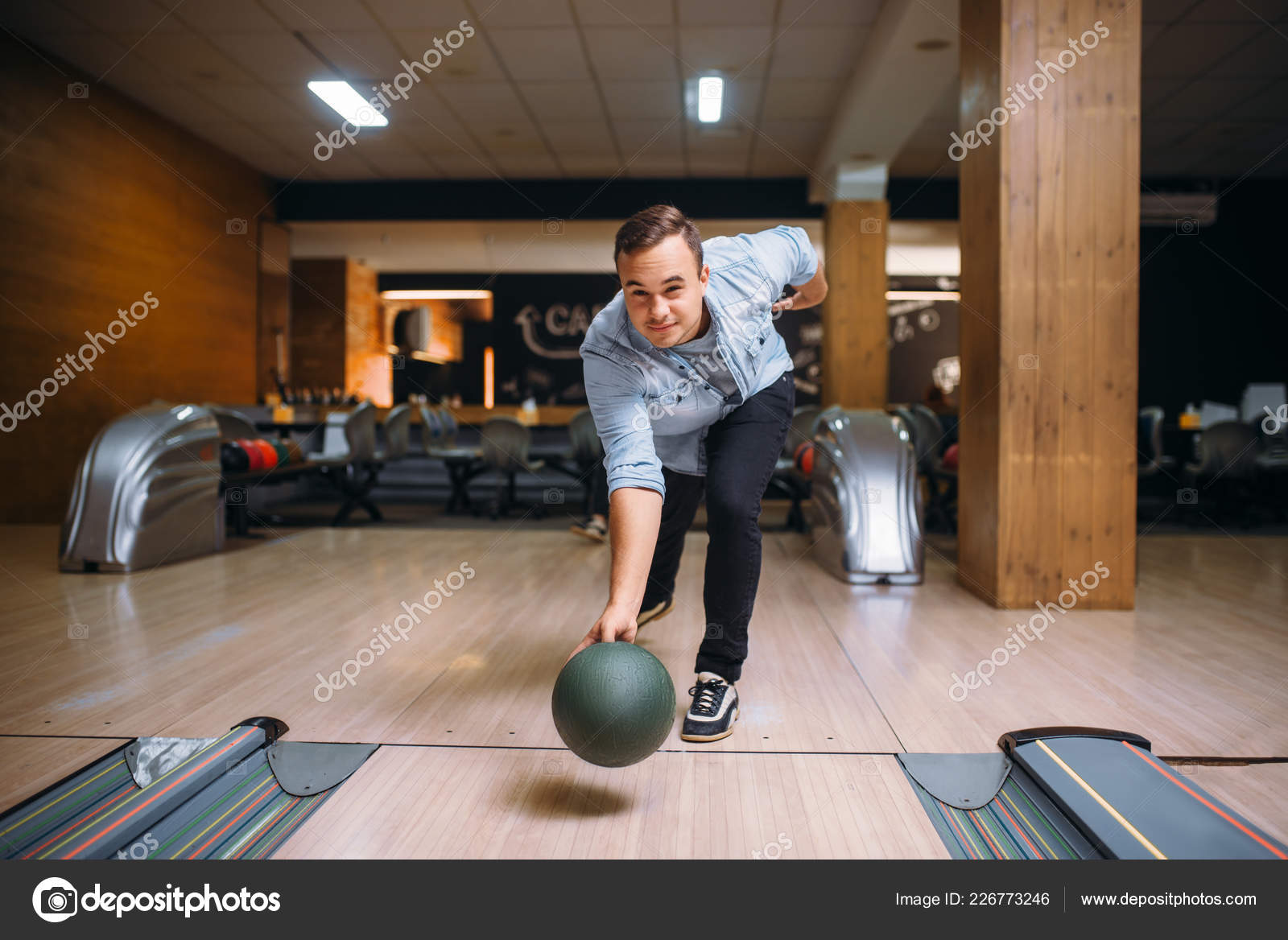 Male Bowler Throws Ball Lane Front View Bowling Alley Player Stock Photo by ©Nomadsoul1 226773246