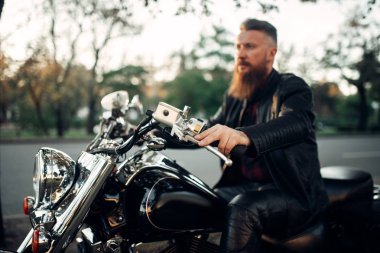 Biker sitting on a motorcycle, classical chopper. Vintage bike, rider and his two-wheeled friend, freedom lifestyle, biking clipart