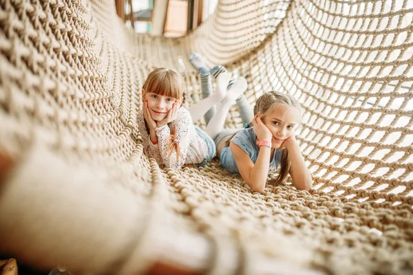 Two Funny Girls Poses Rope Net Children Game Center Excited — Stock Photo, Image