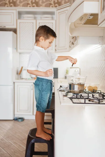 Litte Boy Cooking Melt Chocolate Kitchen Happy Child Standing Chair — Stock Photo, Image