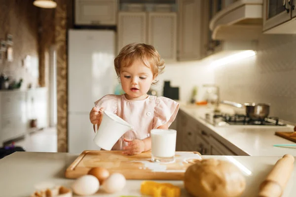 Litte Girl Pours Milk Glass Pastry Melted Chocolate Preparation Kid — Stock Photo, Image