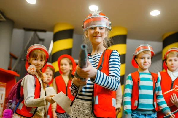 Child Helmet Uniform Hose Hands Playing Fireman Playroom Indoor Kids — Stock Photo, Image