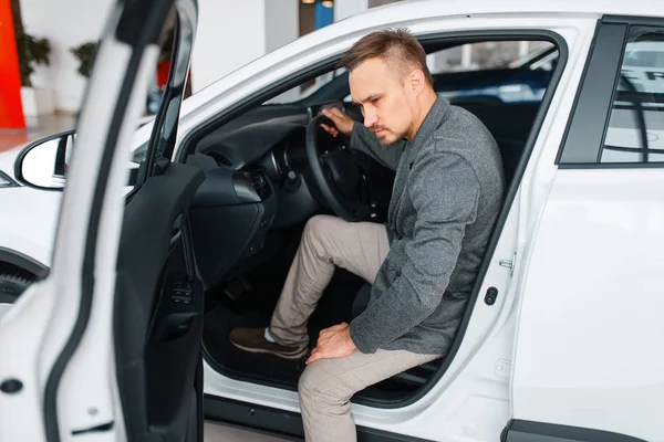 Man Sitting New Car Showroom Male Customer Choosing Vehicle Dealership — Stock Photo, Image