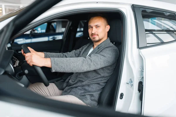 Man Sitting New Car Showroom Male Customer Choosing Vehicle Dealership — Stock Photo, Image