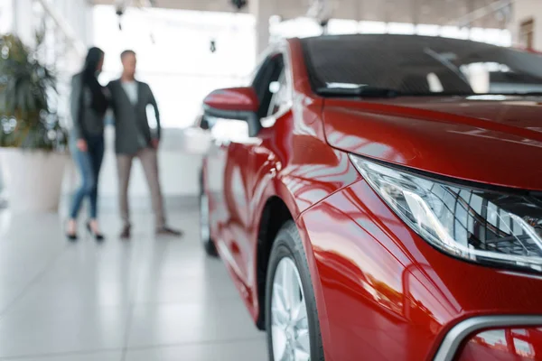 Couple Buying New Red Car Showroom Male Female Customers Looks — Stock Photo, Image