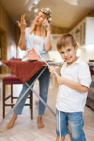 Housewife Talking Phone Kid Fooling Iron Kitchen Woman Child Playing — Stock Photo, Image