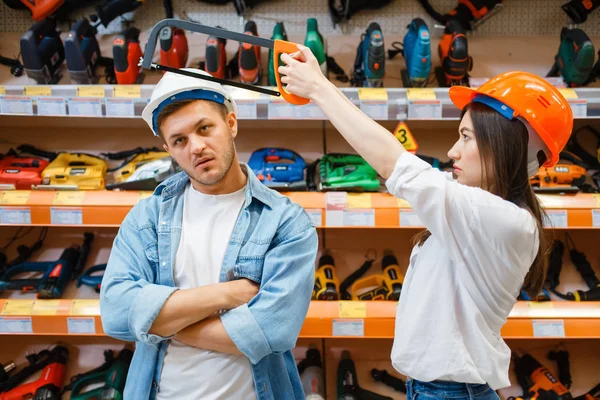 Playful Couple Choosing Tools Hardware Store Male Female Customers Look — Stock Photo, Image