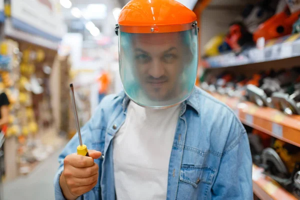 Male Buyer Mask Holds Screwdriver Hardware Store Customer Look Goods — Stock Photo, Image
