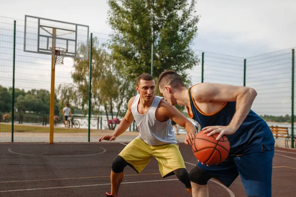 Two Basketball Players Playing Intense Match Outdoor Court Male Athletes — Stock Photo, Image