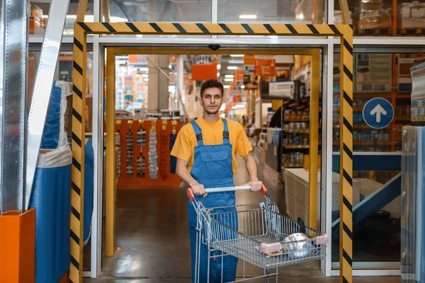 Male Builder Carries Building Materials Cart Hardware Store Customer Look — Stock Photo, Image